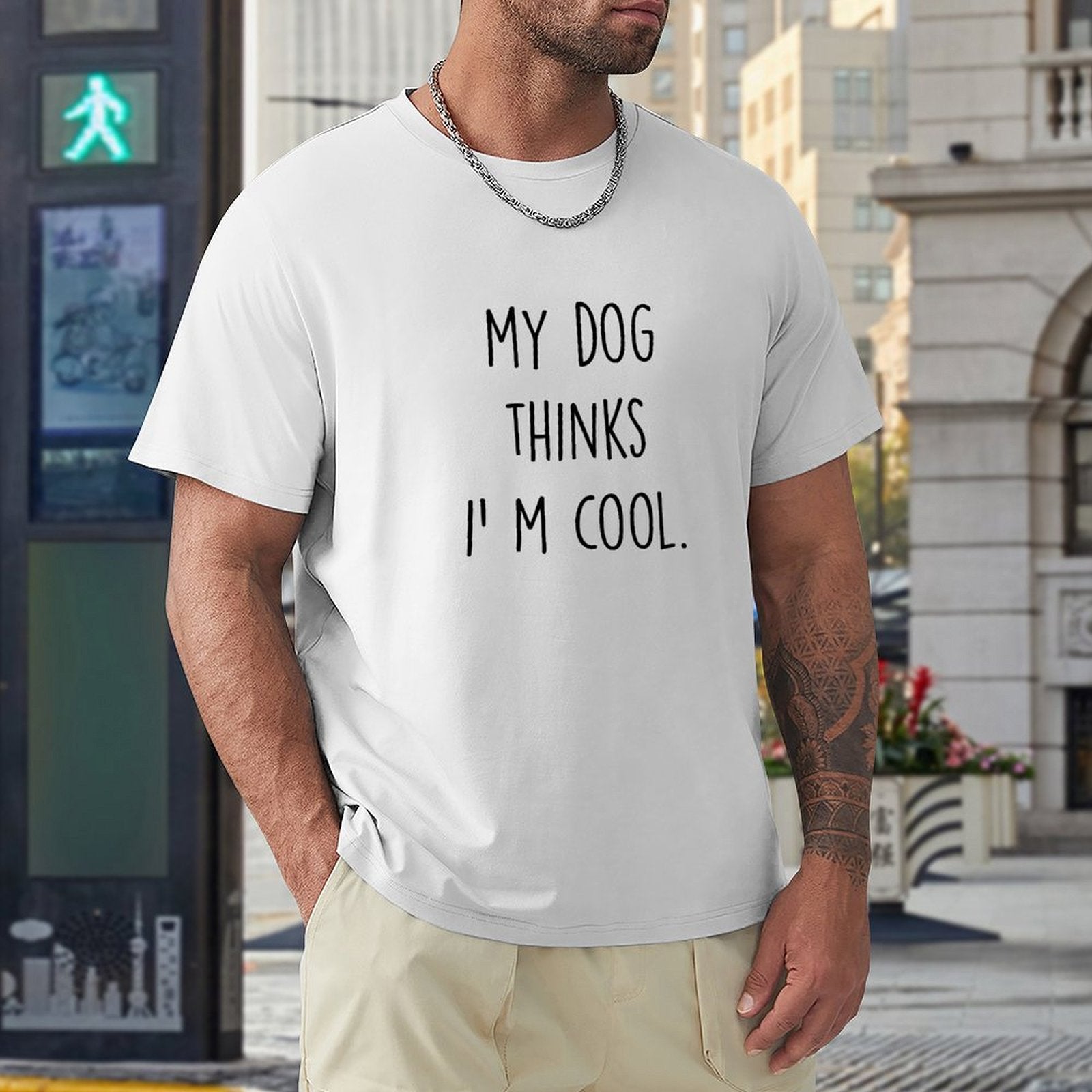 Men's white crew neck t-shirt with "My Dog Thinks I'm Cool" print, cotton tee for dog lovers.