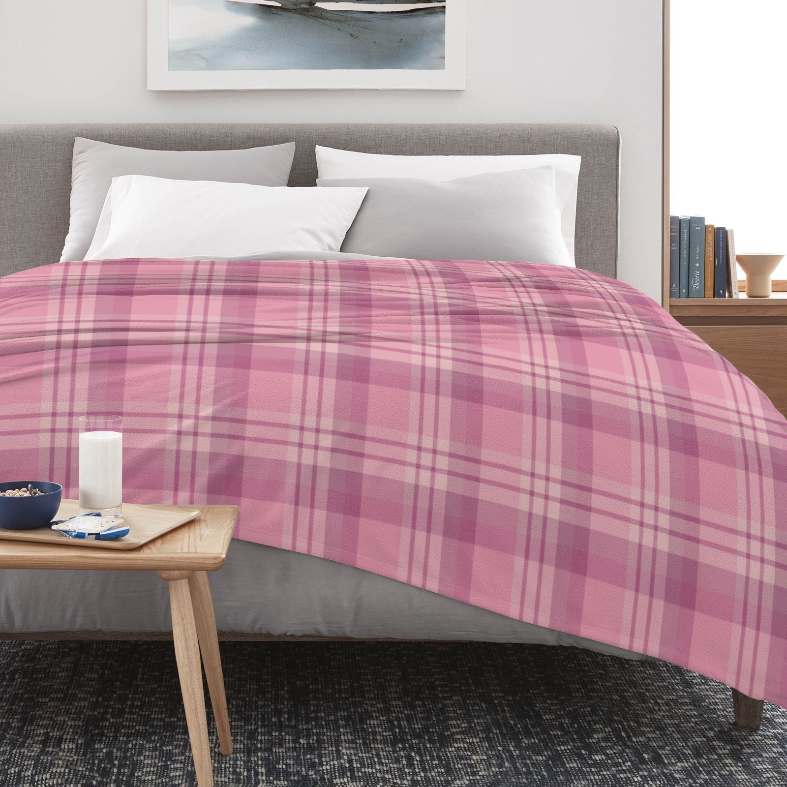 Pink buffalo plaid flannel blanket on bed, USA made for home decor and comfort.