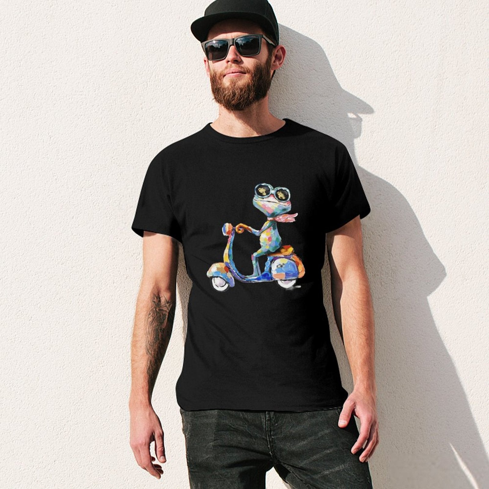 Black cotton men's t-shirt with colorful frog scooter design. Artistic and comfortable.