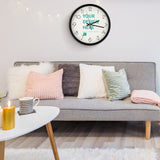 Customizable round clock with 'YOUR DESIGN HERE' text and black frame, home decor