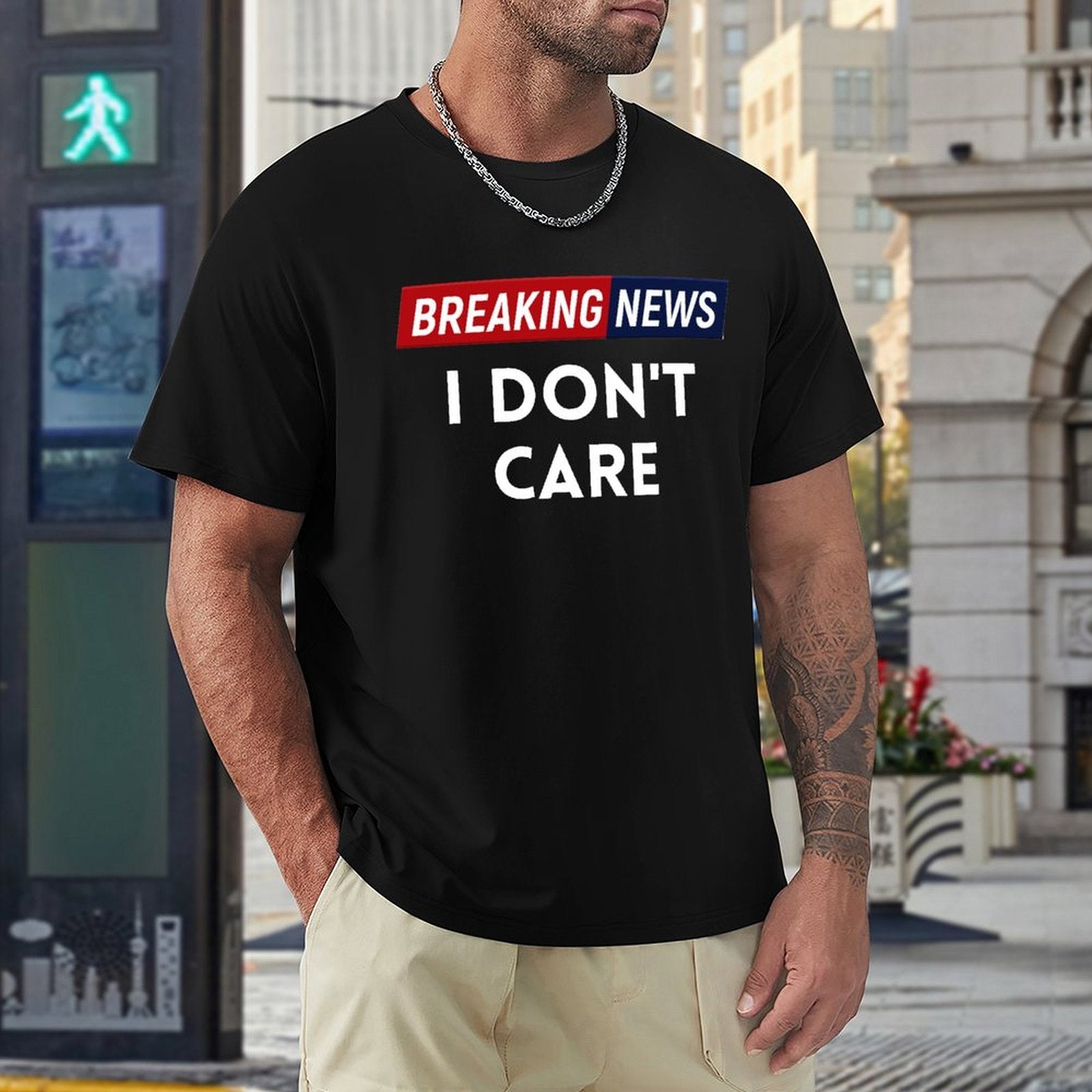 Black men's crew neck t-shirt with "Breaking News I Don't Care" graphic, classic fit, suitable for multiple occasions.