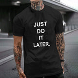 Black Gildan unisex T-shirt with "JUST DO IT LATER." print; cotton tee, perfect for casual wear, MyArtsyGift.com