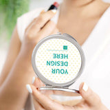 Customizable compact mirror with silver frame, featuring "YOUR DESIGN HERE" for a personalized gift for women.
