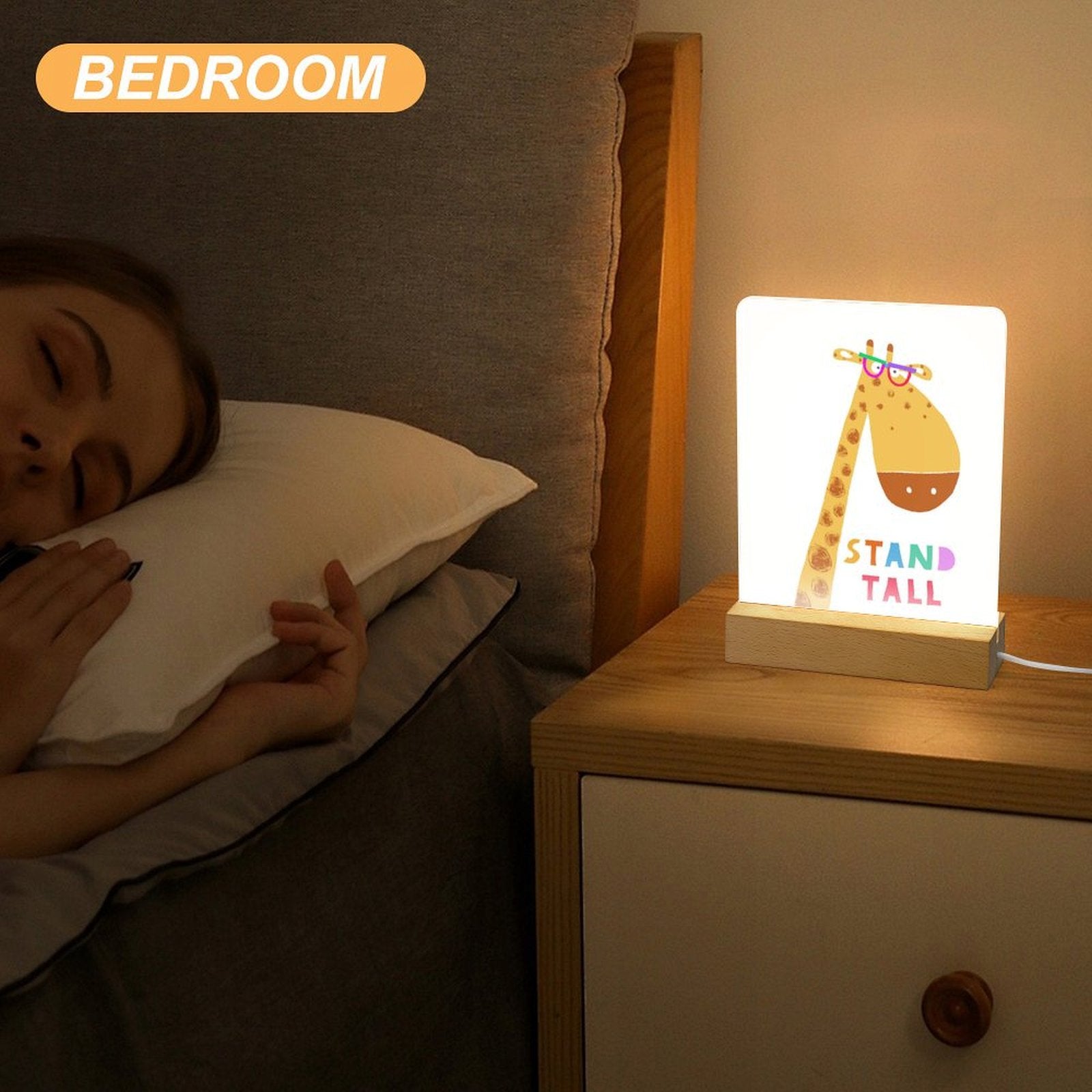 Acrylic night light with giraffe design, wooden base, and 'STAND TALL' text, ideal for bedroom decor and gifts for kids.