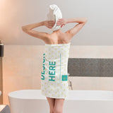 Customizable beach towel with 'DESIGN HERE' text, perfect for swimming, made of soft polyester material.