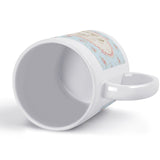 White ceramic personalized coffee mug with floral design and text, perfect gift for any occasion.