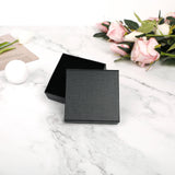 Black gift box for personalized initial bracelet, ideal for a custom name jewelry gift, elegant packaging for MyArtsyGift.