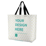 Custom tote bag with "YOUR DESIGN HERE" text, heart pattern, and black handles, ideal for personalized shopping.
