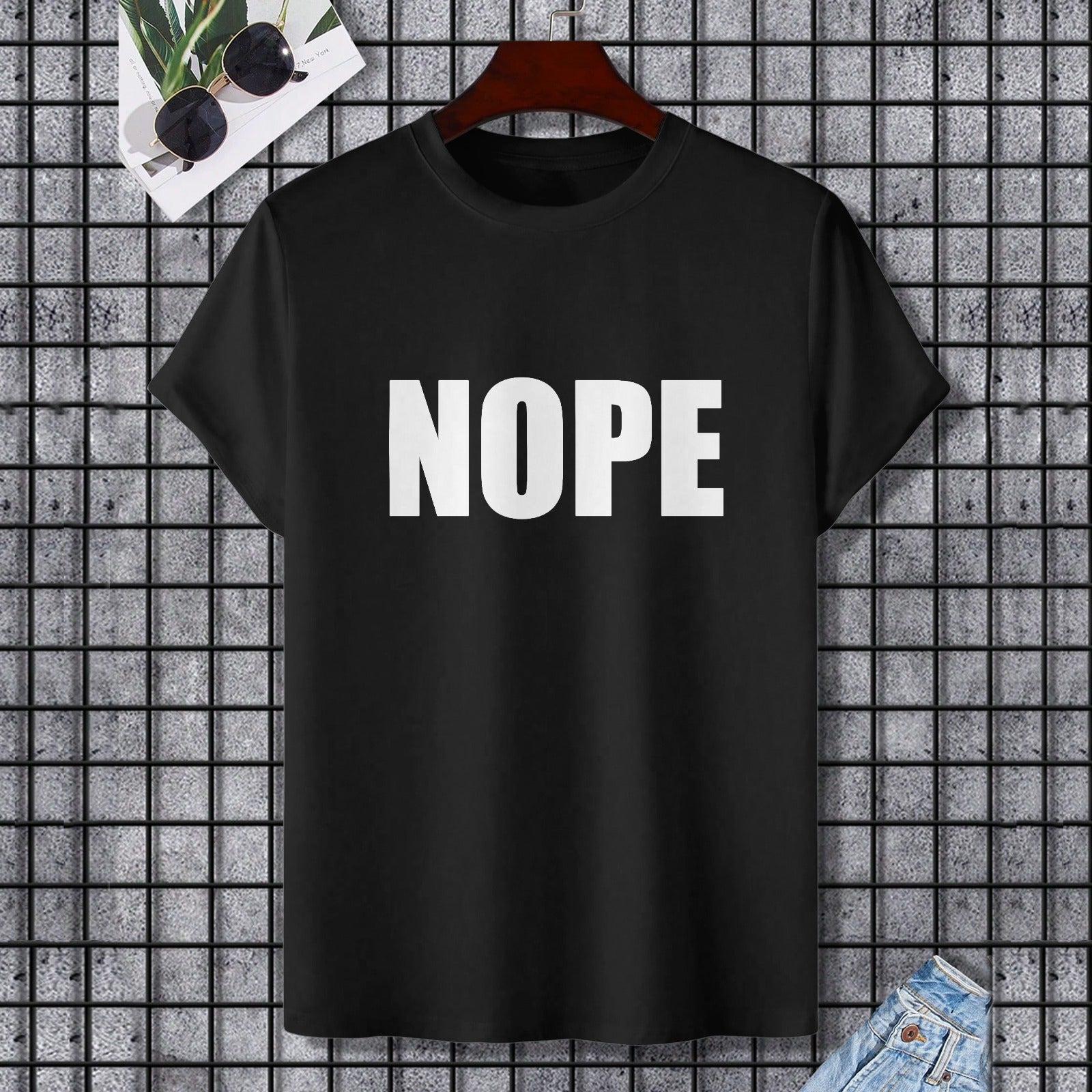 Black Gildan unisex "NOPE" t-shirt. Comfortable cotton tee for casual wear and self-expression.