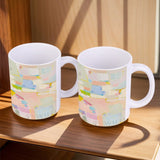 Personalized white ceramic mug with colorful abstract art, a perfect gift for home or office.