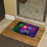 Coral velvet bath rug with neon 'GAME ON' design for bathroom. Non-slip, quick-drying floor carpet.