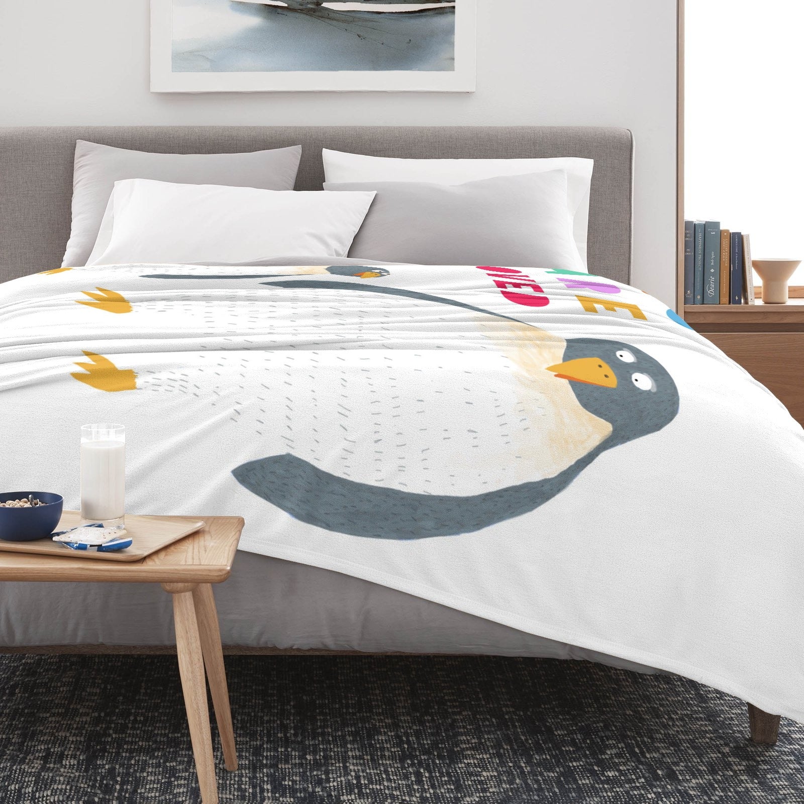 Kids' penguin blanket with "LOVED" text. Super soft flannel kids bedding.