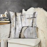 Abstract art throw pillow cover in neutral tones on a white chair for home decor