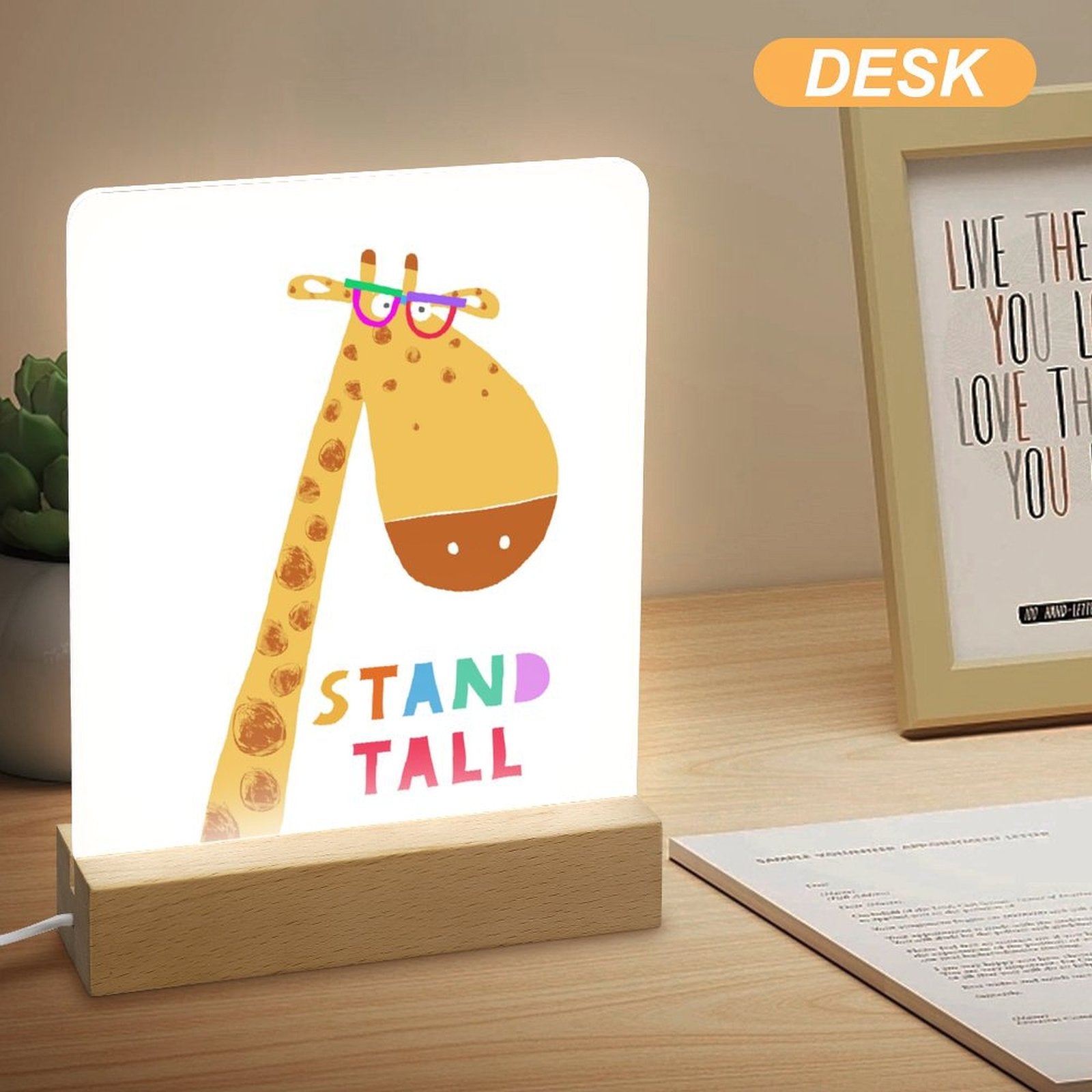 Giraffe acrylic night light with wooden base and 'STAND TALL' text. A perfect gift for kids and bedroom decor.