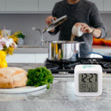 Customizable white digital alarm clock, time, date, temp display. Bedroom alarm clock design.