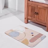 Coral velvet bath rug with geometric design; non-slip and absorbent bathroom floor carpet