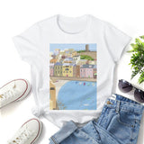 White crewneck t-shirt with coastal town art print, perfect for art lovers.