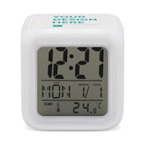 Custom Digital Alarm Clock for Bedroom, White plastic cube with digital display showing time, date and temperature.