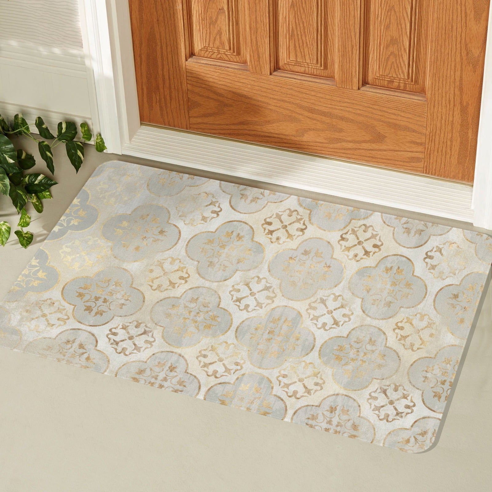 Boho doormat with quatrefoil pattern in gold and cream, ideal for indoor or outdoor use.