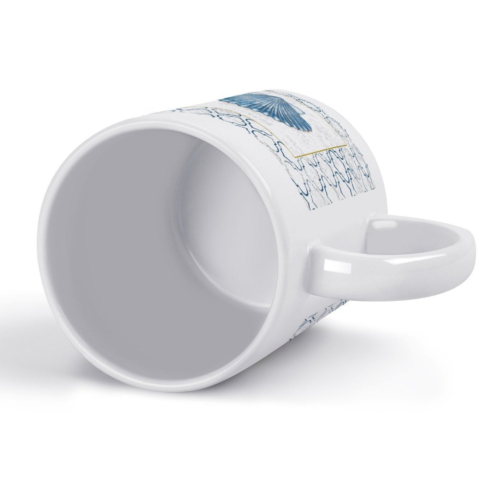 White ceramic coffee mug with blue seashell design, perfect for a personalized gift