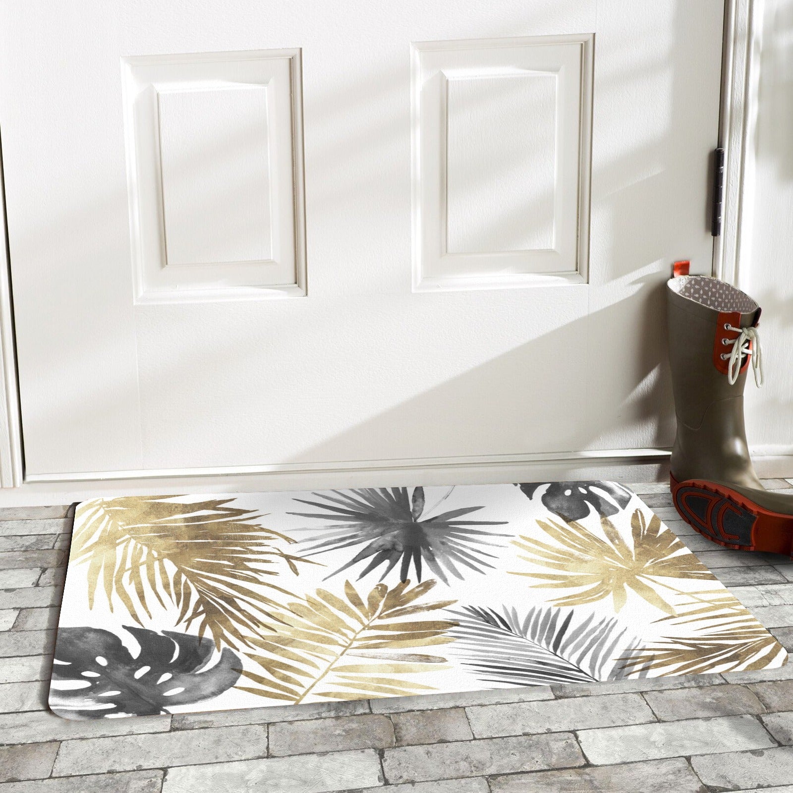 Tropical leaves doormat in gold and gray, indoor/outdoor rubber mat