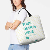 Customizable tote bag with "YOUR DESIGN HERE" text, heart pattern, and black straps, perfect for shopping and gifts.