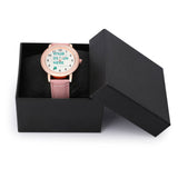 Customizable pink leather watch for women with rose gold case. Dial reads 'YOUR DESIGN HERE' in the watch box.