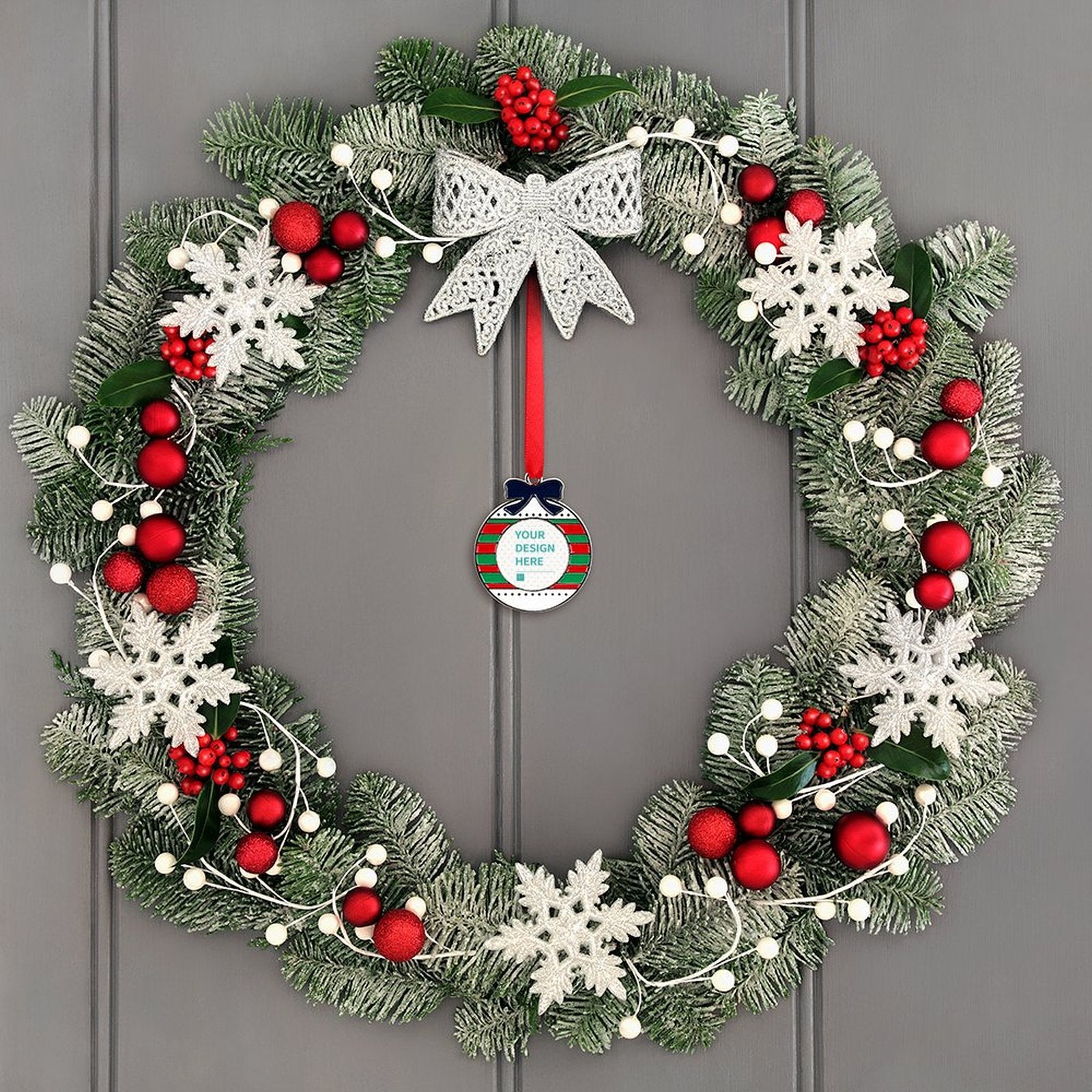 Personalized alloy Christmas ornament with 'YOUR DESIGN HERE' hanging on a wreath with red accents for Xmas decorations