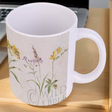 White ceramic mug with Wild Apple wildflower design, personalized gift, perfect for home or office, made in USA.