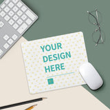 Customizable mouse pad with 'YOUR DESIGN HERE' text, perfect for offices and gaming. White mouse and heart pattern.
