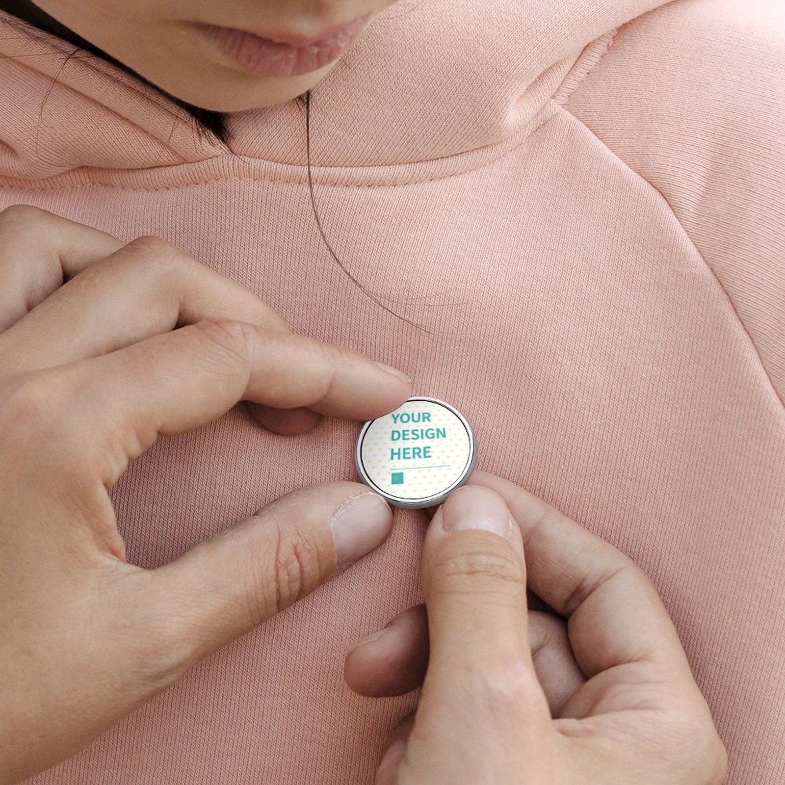 Custom round alloy lapel pin with 'YOUR DESIGN HERE' text, personalized for shirt or jacket