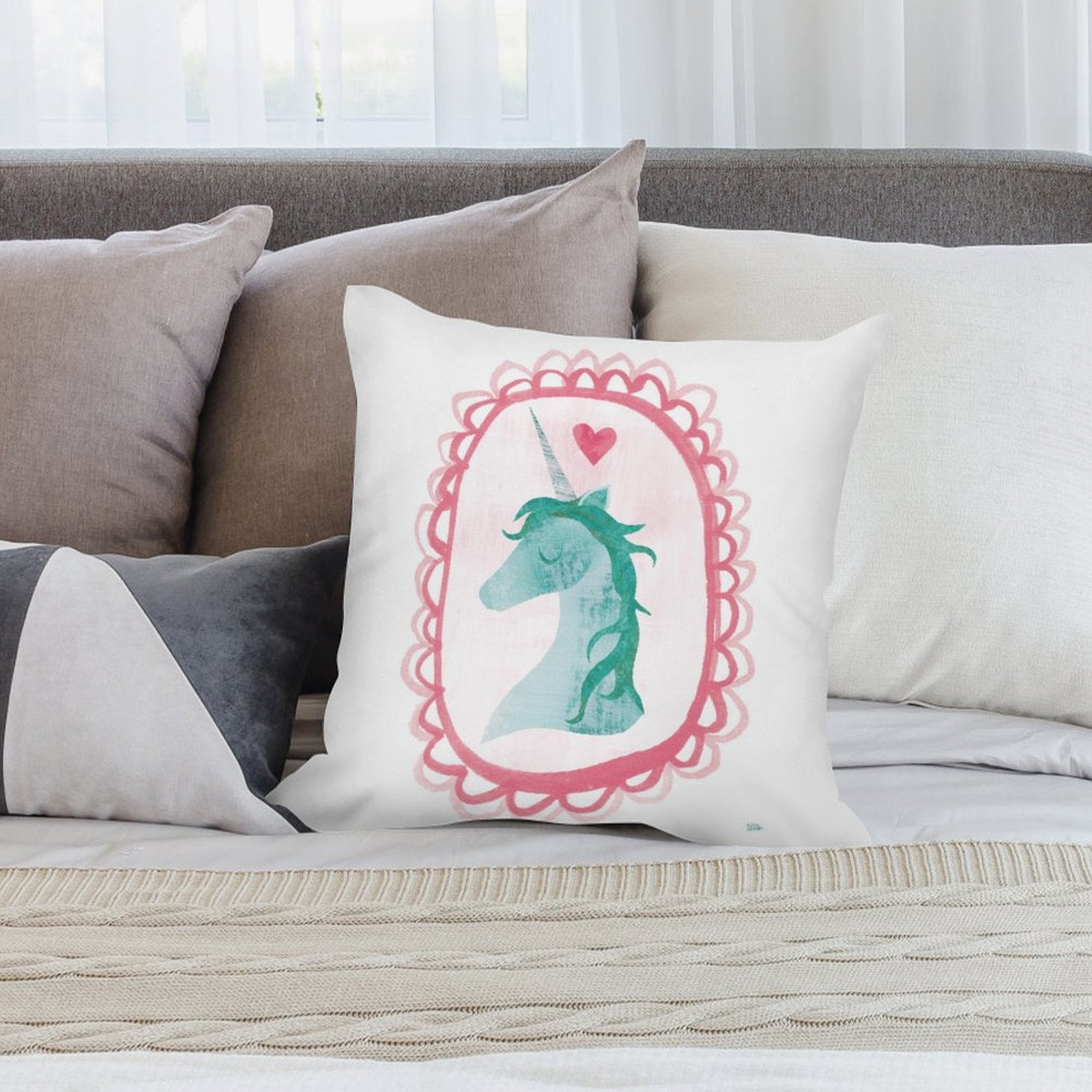 Soft plush unicorn pillow cover on bed; featuring a watercolor unicorn design, perfect for the living room or couch.