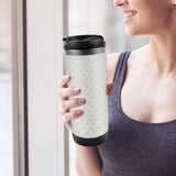 Personalized stainless steel travel mug with heart pattern held by a woman, for custom gifts, leak-proof design.