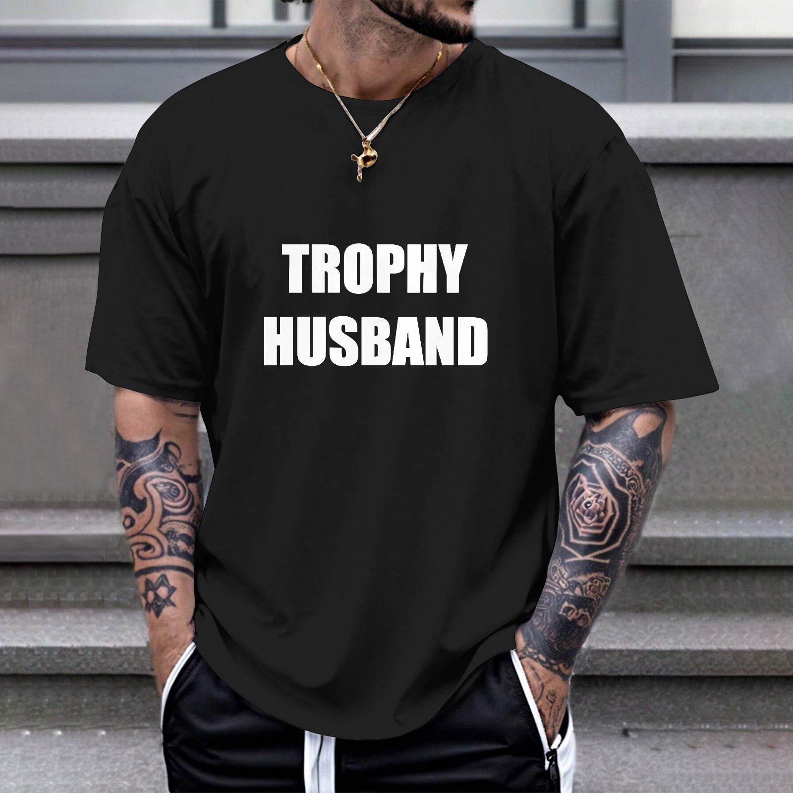 Black Gildan TROPHY HUSBAND T-shirt, comfortable cotton tee for casual wear and gifting.