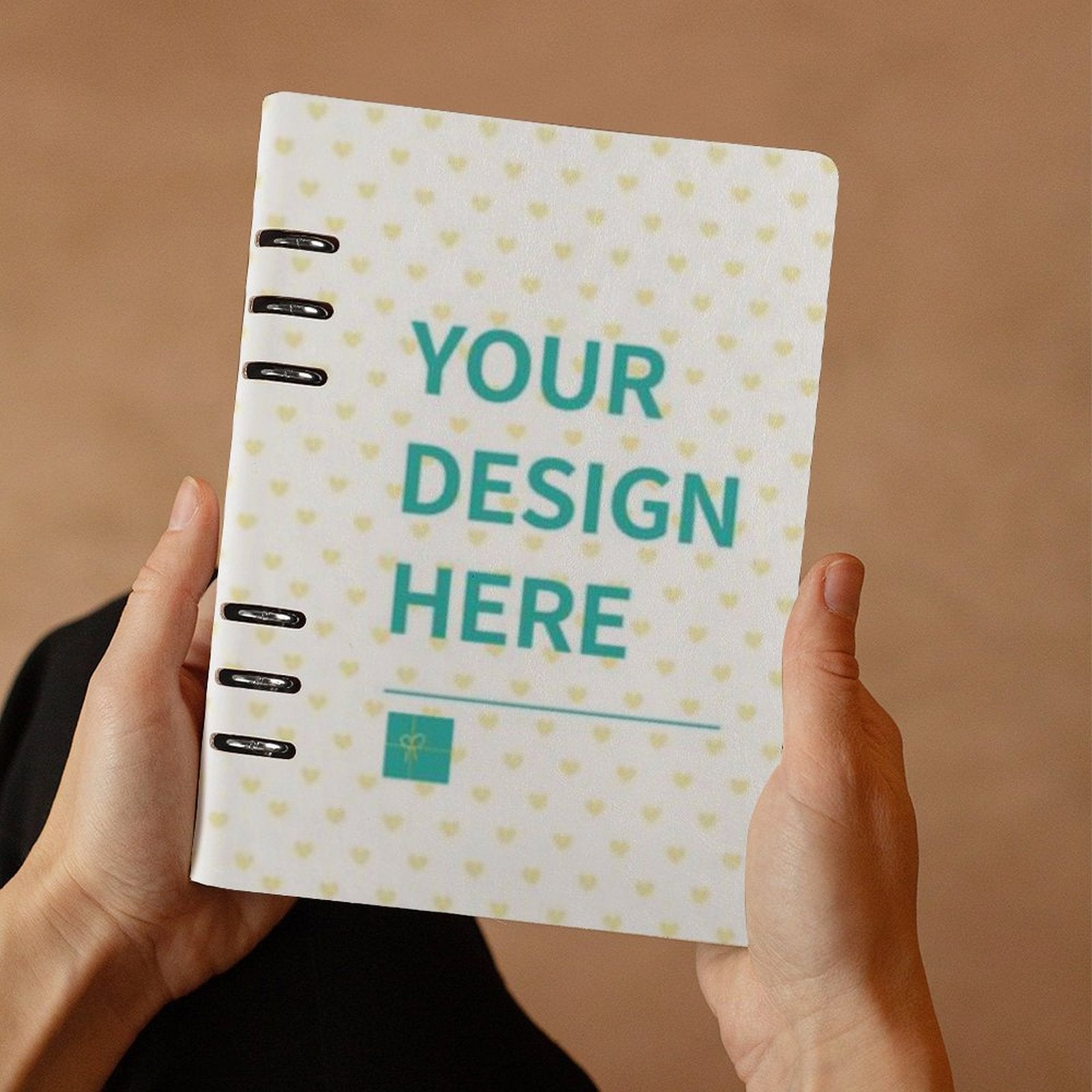 Custom loose-leaf notebook with 'YOUR DESIGN HERE' design and heart pattern, perfect for note-taking and office use.