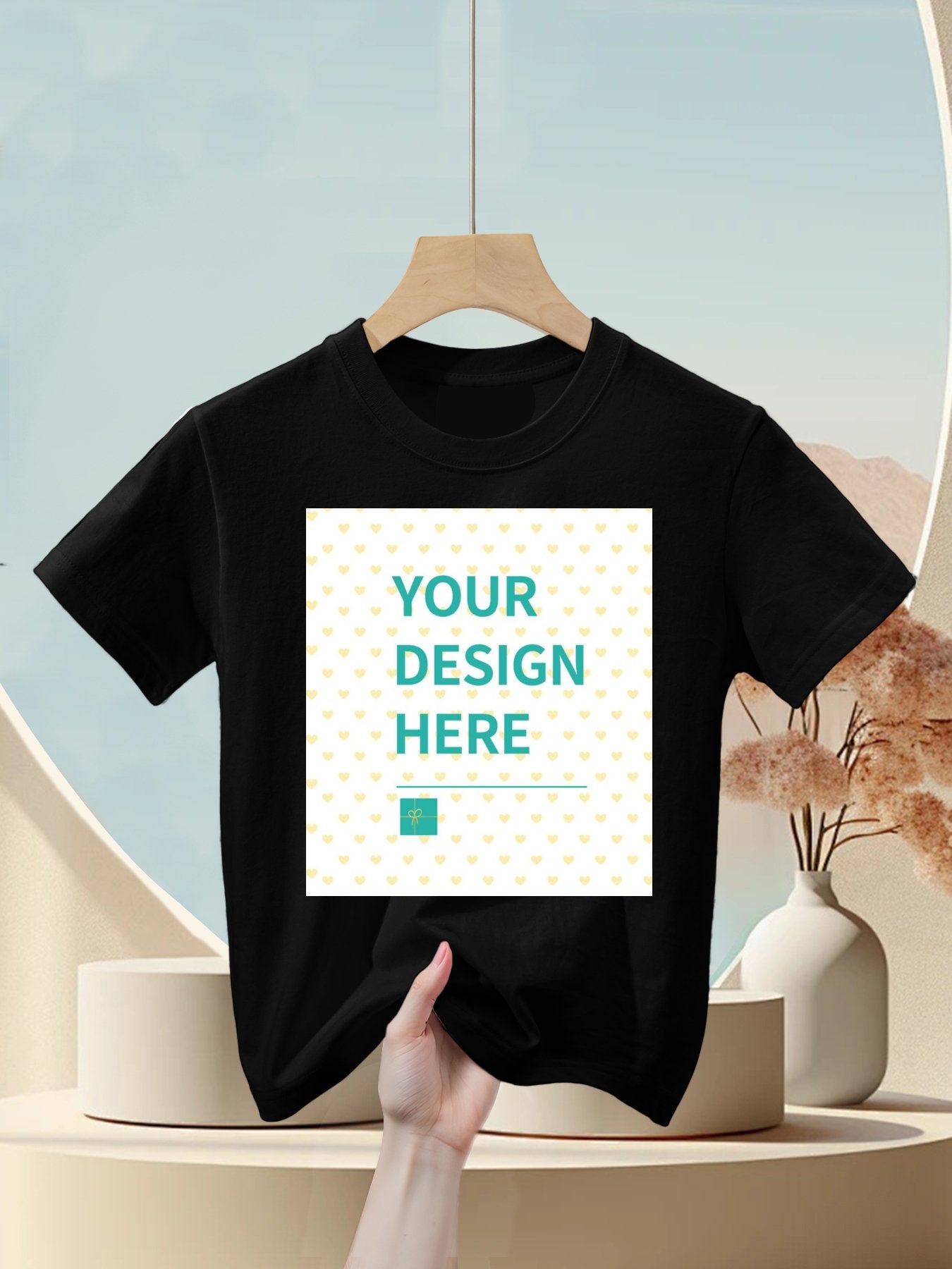 Customizable black cotton kids t-shirt with 'YOUR DESIGN HERE' design area for personalized gifts, made in USA