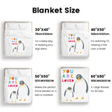 Penguin blanket size guide: super soft flannel kids bedding with "YOU ARE LOVED" text; available in multiple sizes.