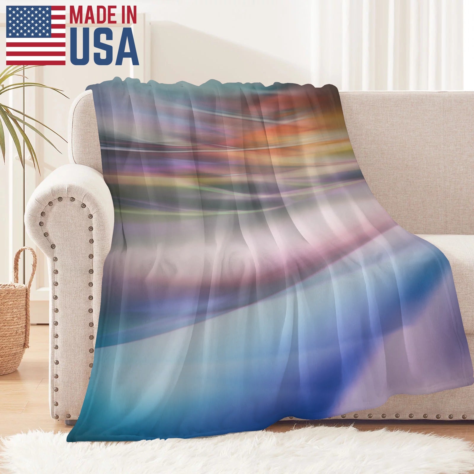 Made in USA colorful flannel blanket draped on a sofa, perfect for couch or bed