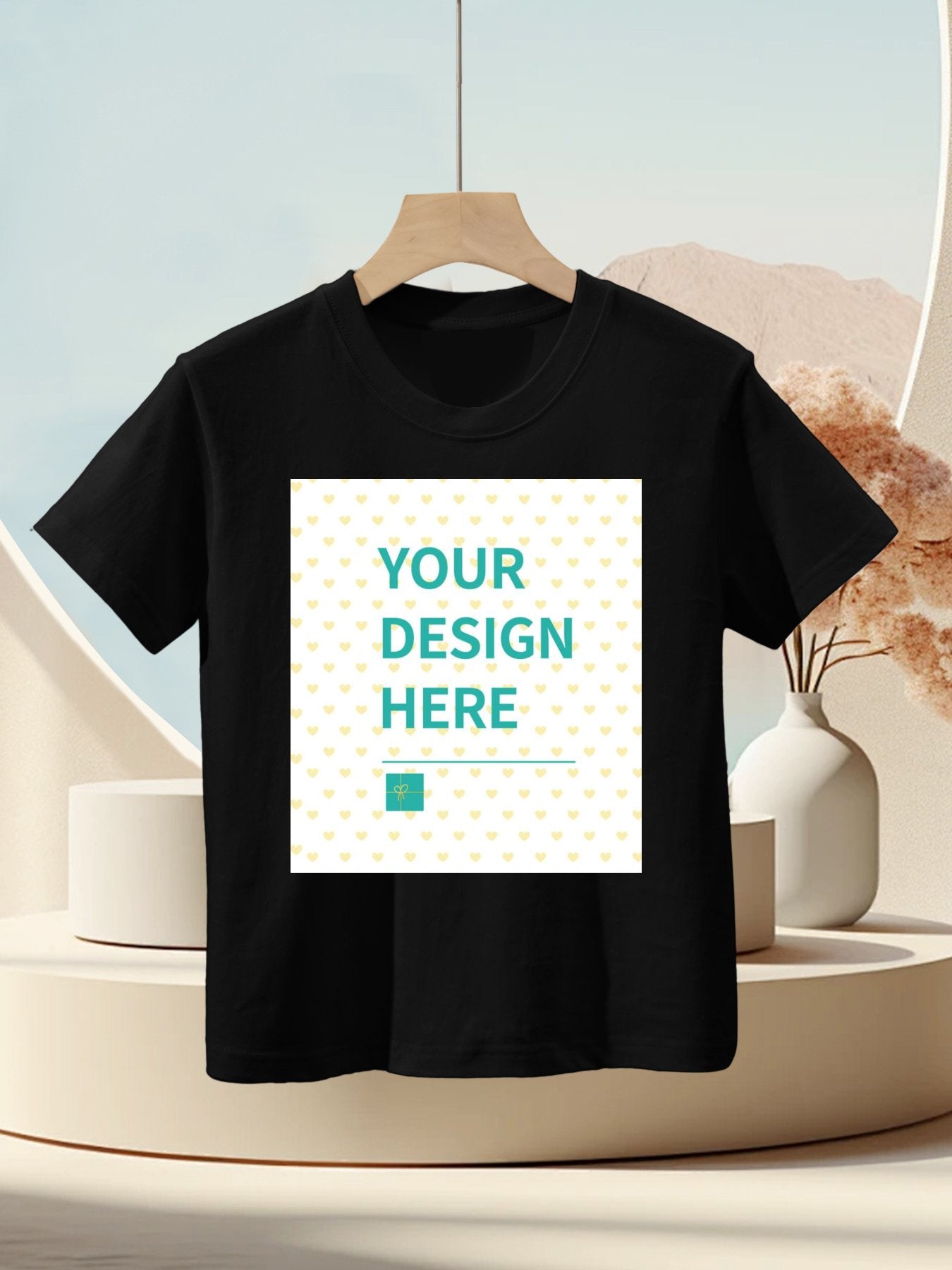 Black customizable kids t-shirt with "YOUR DESIGN HERE" text; perfect for personalized gifts from MyArtsyGift