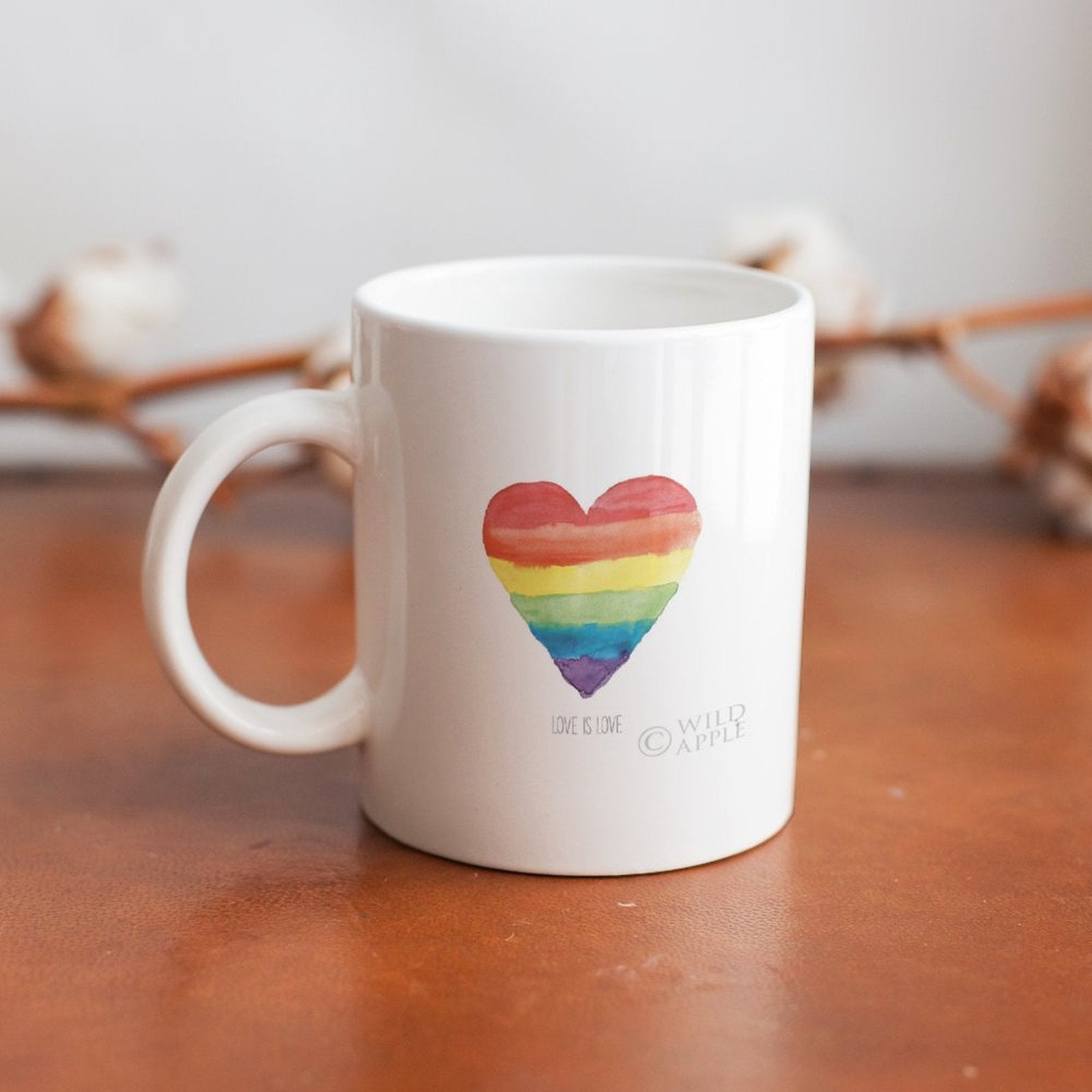 White ceramic mug with rainbow heart and Love is Love text, Pride gift