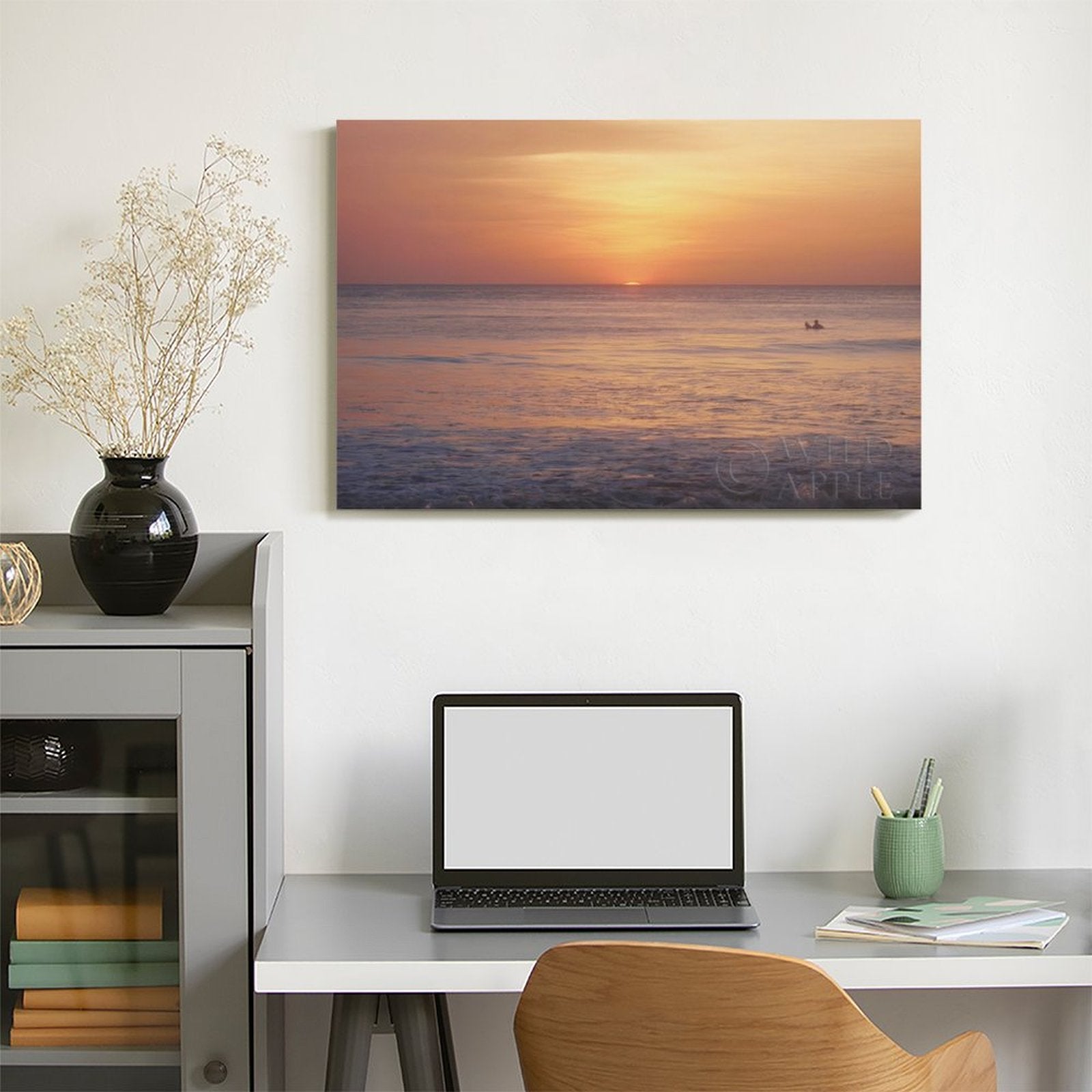 Sunset ocean canvas wall art on desk, ready to hang. Perfect for home decor, living room or bedroom, by Wild Apple.
