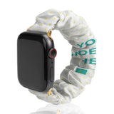 White polyester scrunchie Apple Watch band with yellow dots and "YO DE HE" design. Comfortable, easy to install and washable.