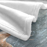 Winter snow forest deer flannel blanket detail. Soft white fleece texture on cozy blanket, perfect for sofa or bed.