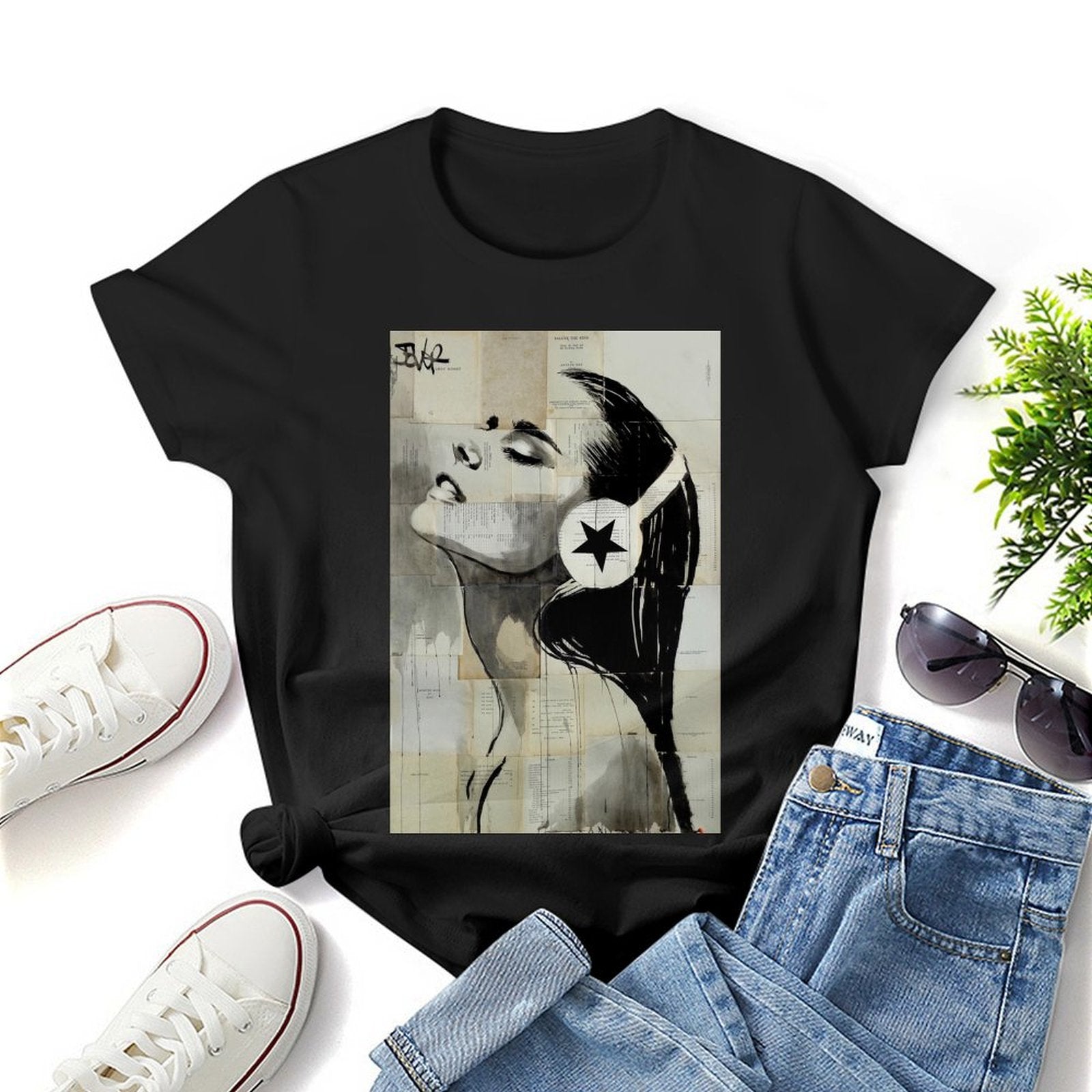 Black graphic t-shirt with woman and headphone art print. Crewneck tee.