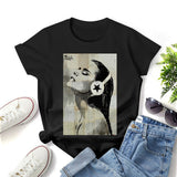 Black graphic t-shirt with woman and headphone art print. Crewneck tee.