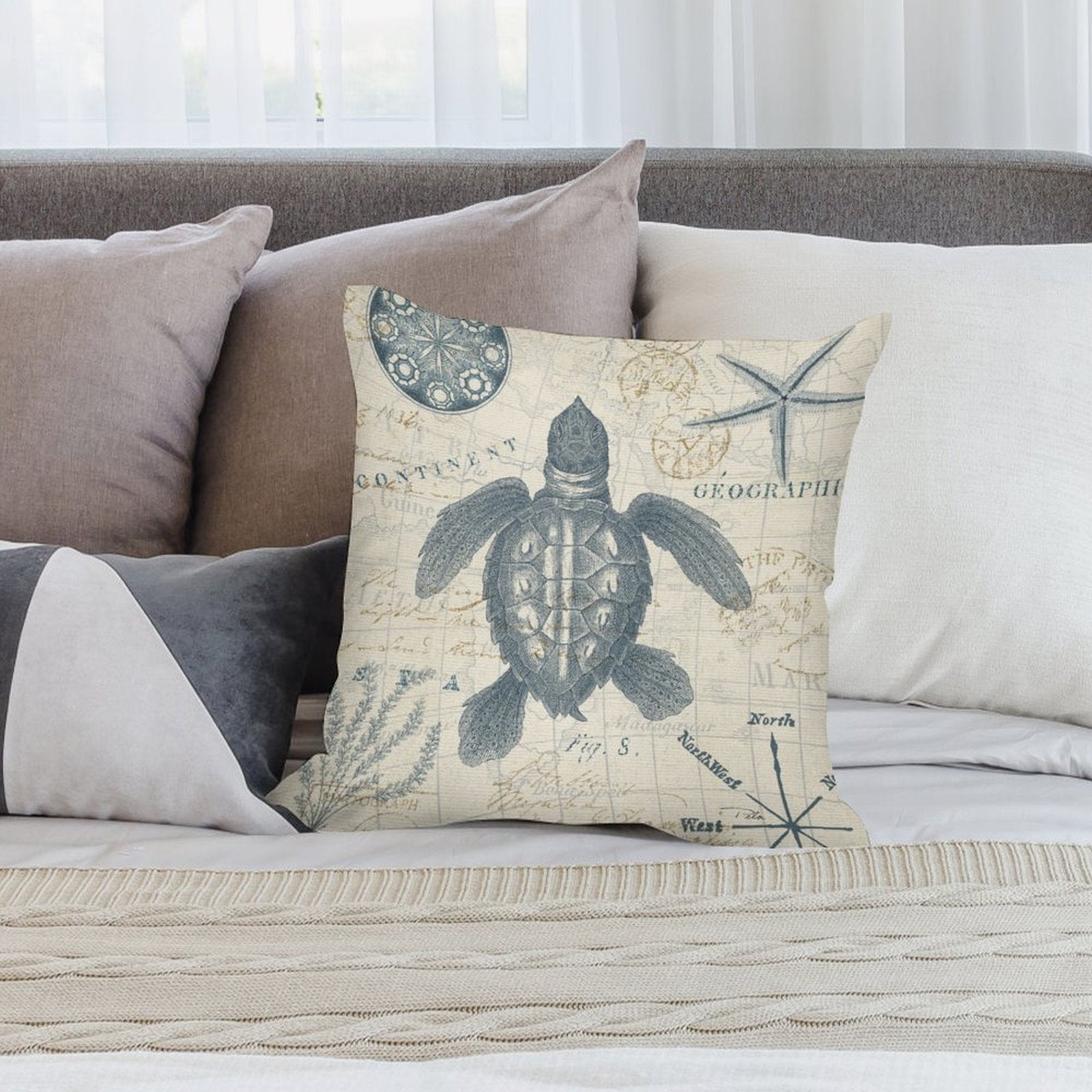 Sea turtle pillow cover on bed, vintage map design, soft plush material. Decorative pillow for living room or bedroom.