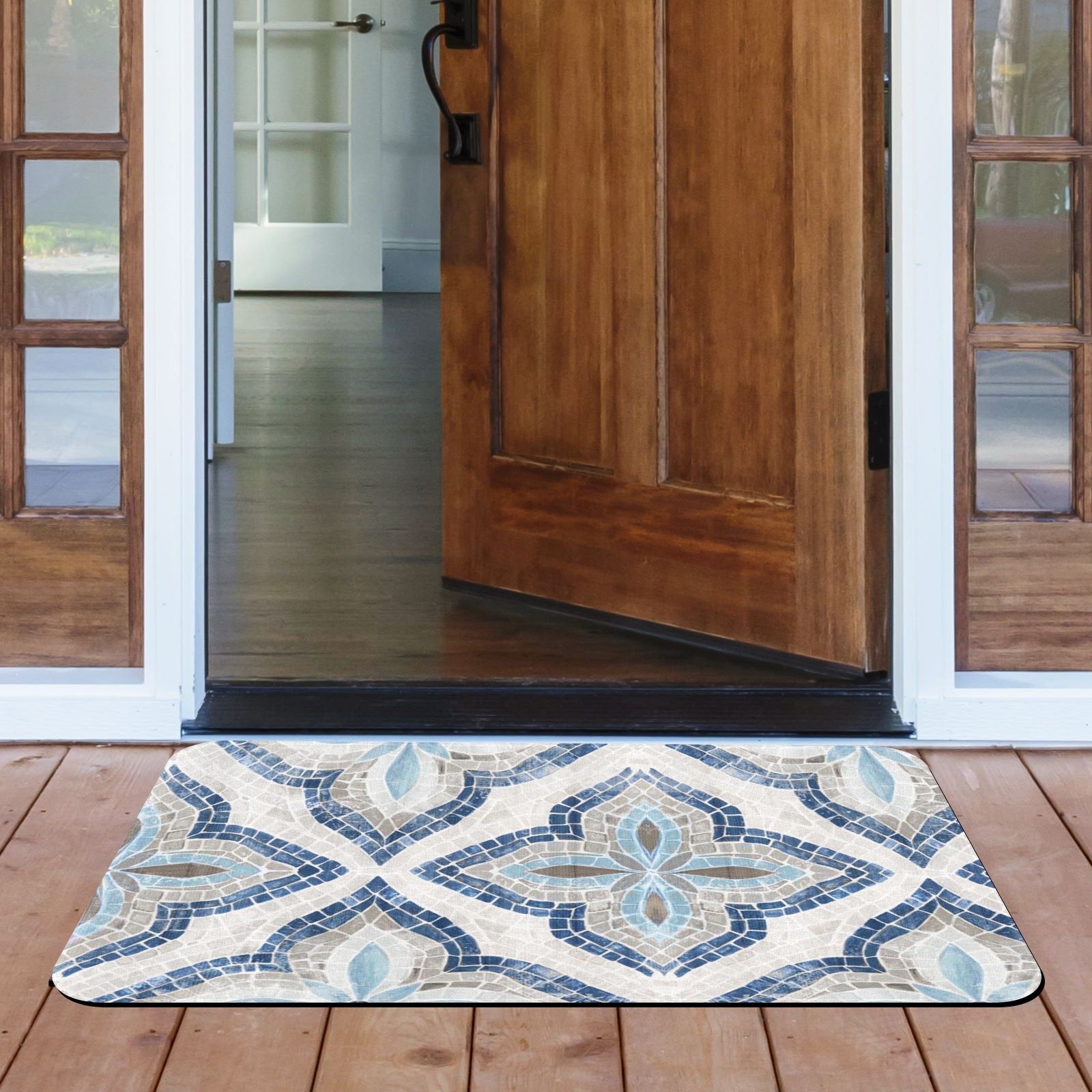 Blue mosaic patterned rubber doormat at a doorway. Indoor/Outdoor entrance mat for home.