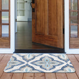 Blue mosaic patterned rubber doormat at a doorway. Indoor/Outdoor entrance mat for home.