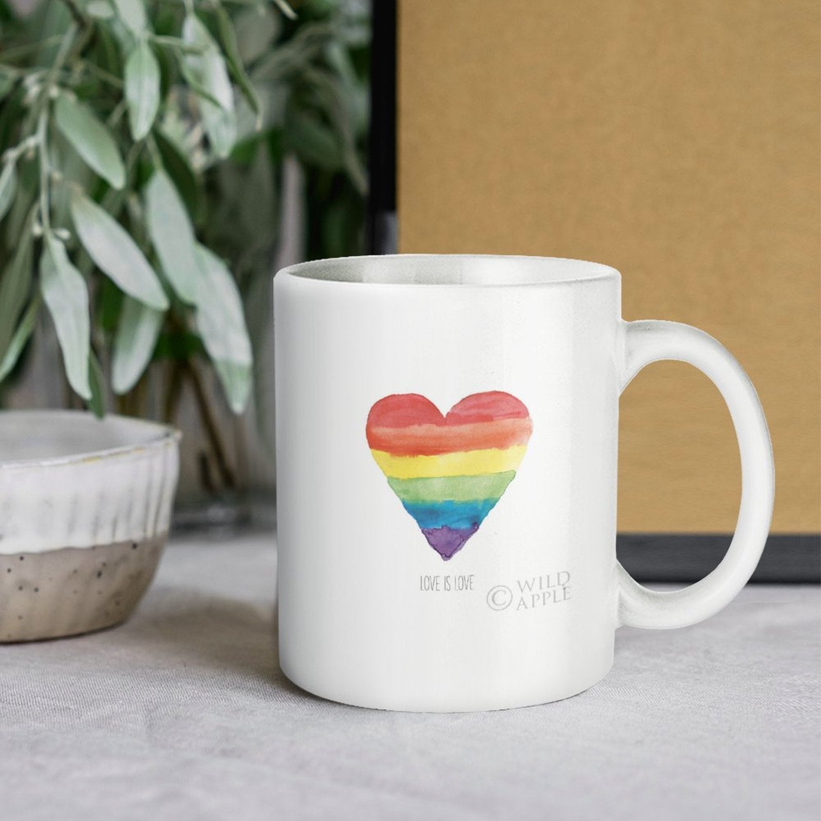 White ceramic mug with rainbow heart, 'Love is Love' text, perfect Pride gift