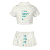 Customizable cheerleader uniform set with 'YOUR DESIGN HERE' text, white top and pleated skirt.